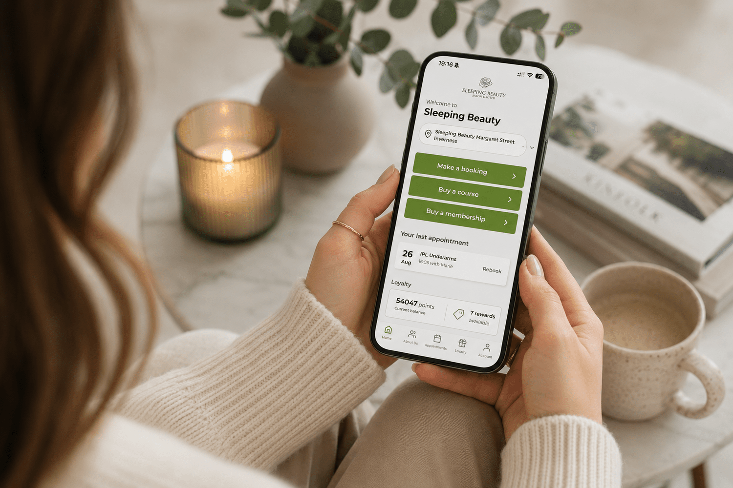 Client using the Sleeping Beauty app to book appointments and view loyalty rewards